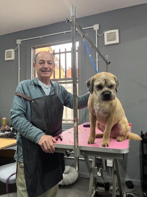 Keith with a freshly groomed border terrier
