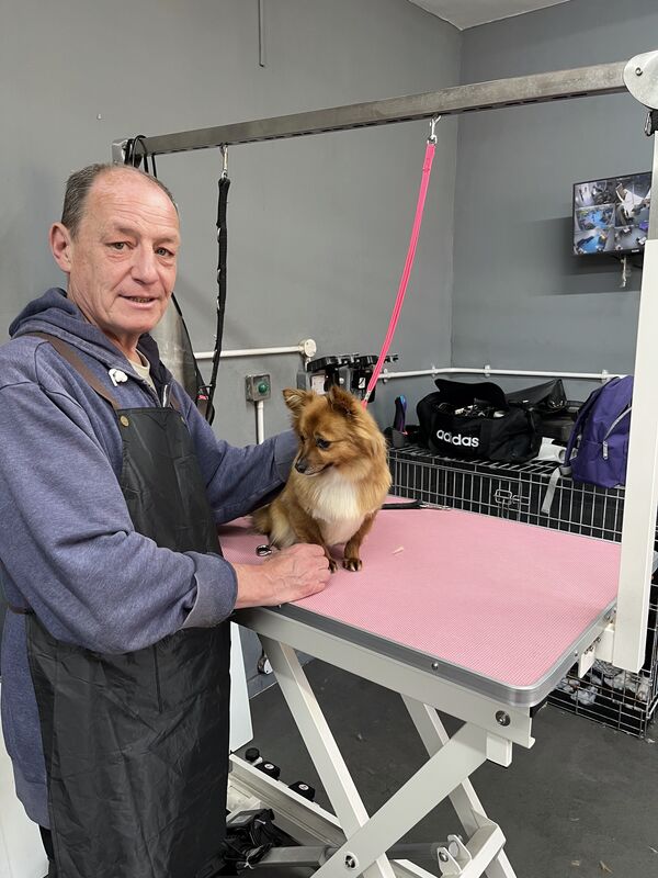 Keith with a chihuahua at the salon