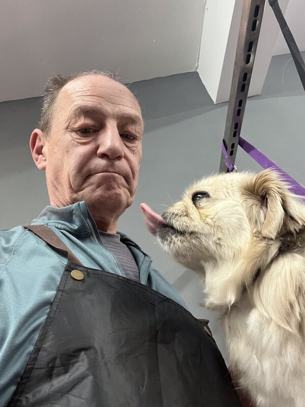 Keith with a cockapoo at the salon